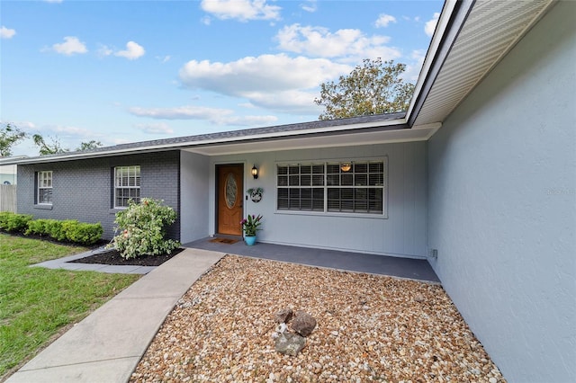 5500 SE 2nd Pl, Ocala, FL 34480 - view of exterior entry featuring stucco siding and brick siding