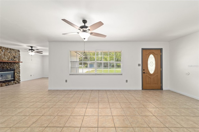 5500 SE 2nd Pl, Ocala, FL 34480 - unfurnished living room with a ceiling fan, a fireplace, and light tile patterned floors