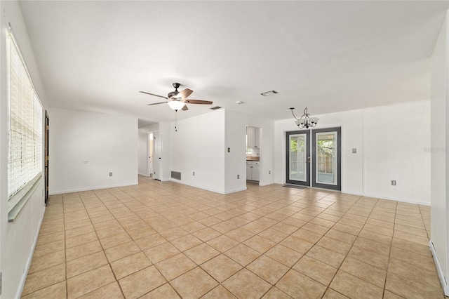 5500 SE 2nd Pl, Ocala, FL 34480 - unfurnished living room with light tile patterned floors, a ceiling fan, and a chandelier