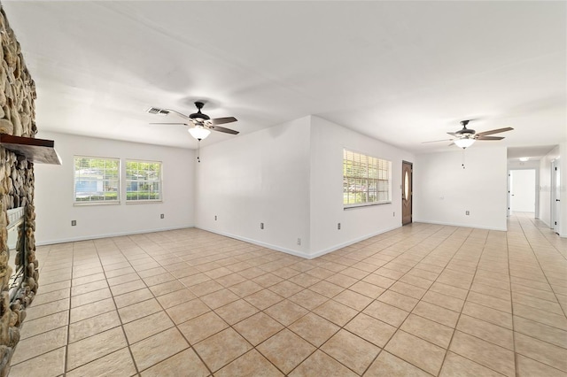 5500 SE 2nd Pl, Ocala, FL 34480 - unfurnished living room featuring a ceiling fan and light tile patterned floors