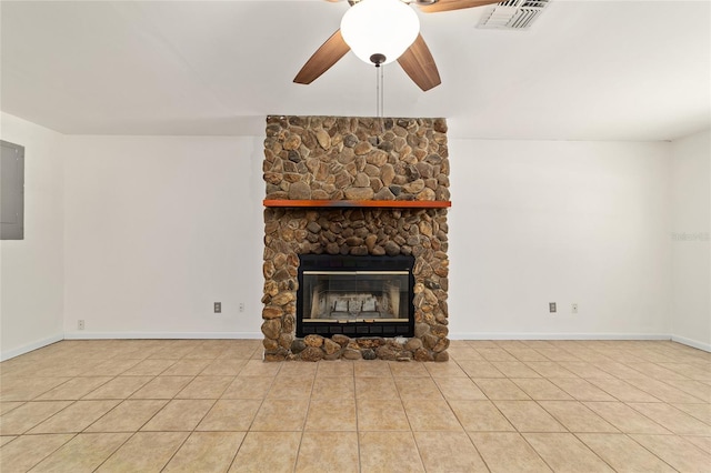 5500 SE 2nd Pl, Ocala, FL 34480 - unfurnished living room with ceiling fan, a stone fireplace, tile patterned floors, and electric panel