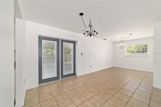 5500 SE 2nd Pl, Ocala, FL 34480 - unfurnished room with a chandelier and light tile patterned floors