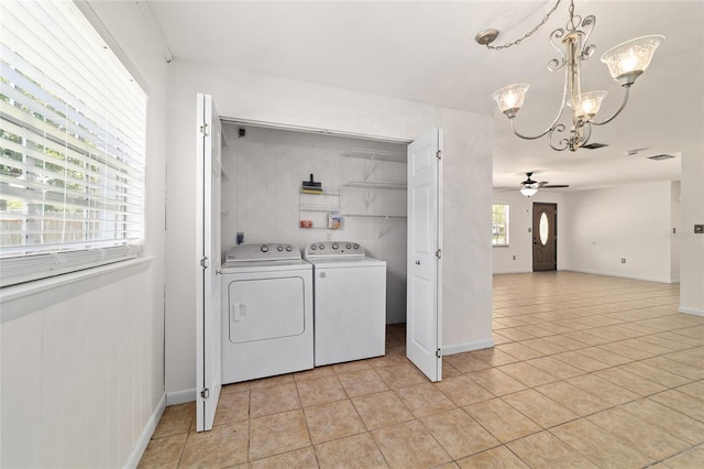 5500 SE 2nd Pl, Ocala, FL 34480 - washroom featuring washing machine and clothes dryer, a chandelier, light tile patterned floors, and ceiling fan