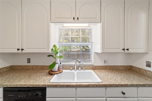 5500 SE 2nd Pl, Ocala, FL 34480 - kitchen featuring black dishwasher, white cabinetry, and light countertops