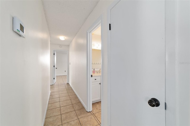 5500 SE 2nd Pl, Ocala, FL 34480 - hallway featuring light tile patterned floors and baseboards