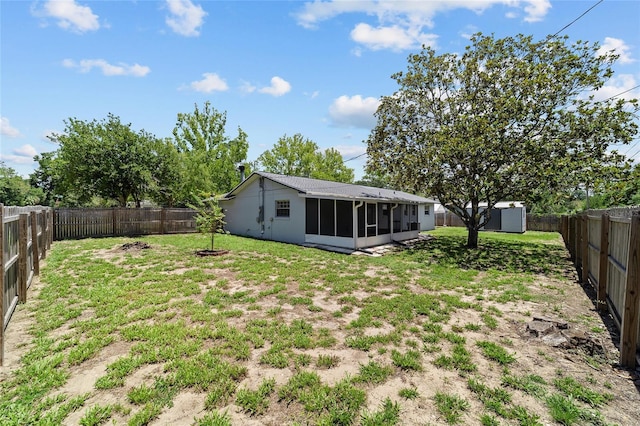 5500 SE 2nd Pl, Ocala, FL 34480 - rear view of house featuring a sunroom, a shed, and a fenced backyard