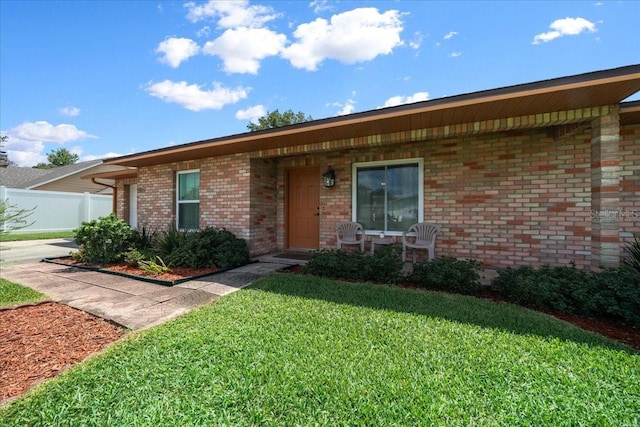5525 NE 22nd Ave, Ocala, FL 34479 - single story home featuring brick siding and a porch