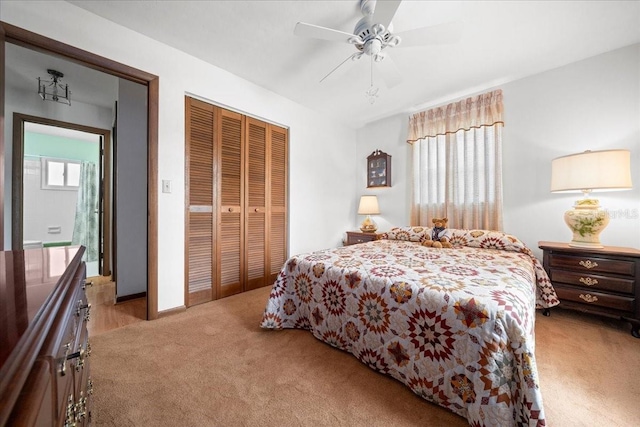 5525 NE 22nd Ave, Ocala, FL 34479 - bedroom featuring light carpet, a closet, and ceiling fan