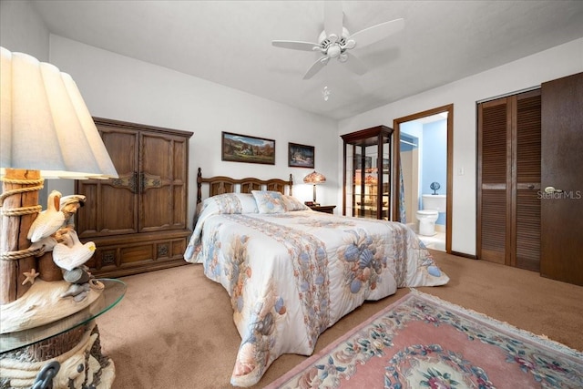 5525 NE 22nd Ave, Ocala, FL 34479 - bedroom with light carpet, ensuite bath, a ceiling fan, and a closet