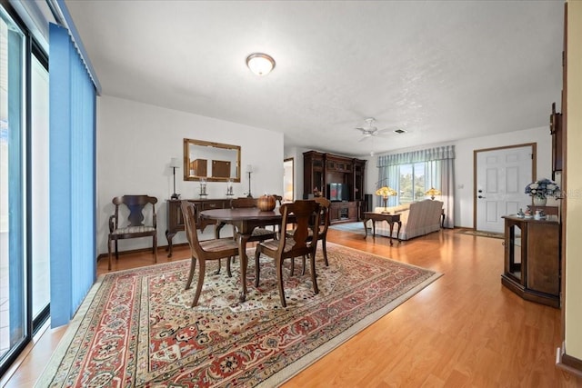 5525 NE 22nd Ave, Ocala, FL 34479 - dining space with a ceiling fan and wood finished floors