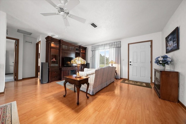 5525 NE 22nd Ave, Ocala, FL 34479 - living area featuring light wood-style flooring and a ceiling fan