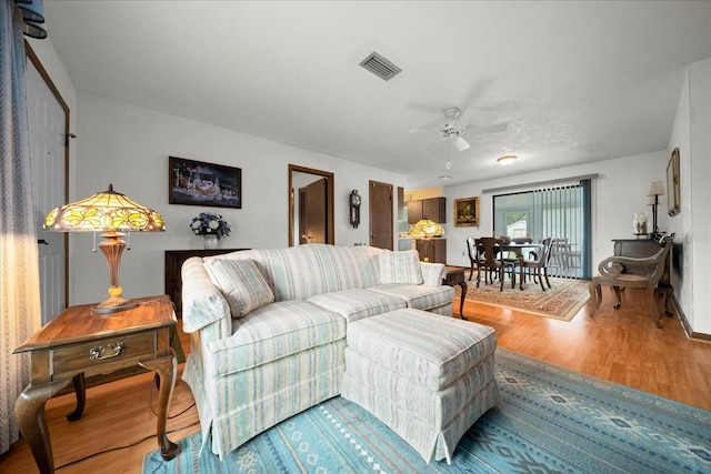 5525 NE 22nd Ave, Ocala, FL 34479 - living room with wood finished floors and ceiling fan