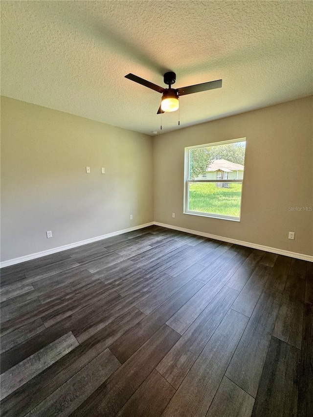 13305 SW 114th Pl, Dunnellon, FL 34432 - empty room featuring dark wood-style flooring, a textured ceiling, and ceiling fan