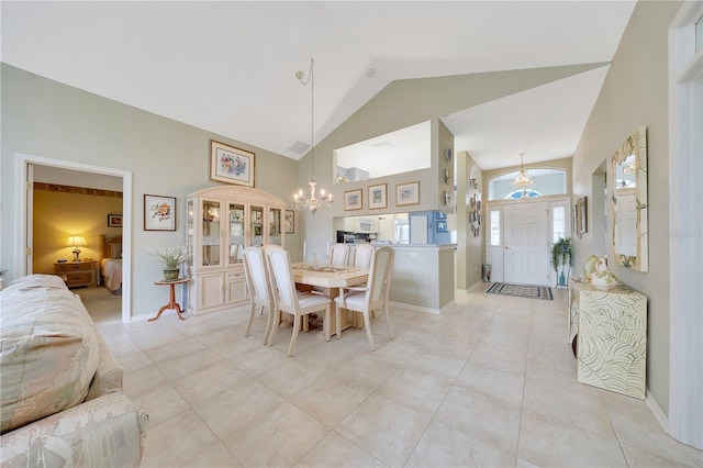 6330 SW 117th Loop, Ocala, FL 34476 - dining area with a chandelier, high vaulted ceiling, and light tile patterned floors