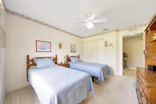 6330 SW 117th Loop, Ocala, FL 34476 - bedroom with light carpet, a closet, and ceiling fan
