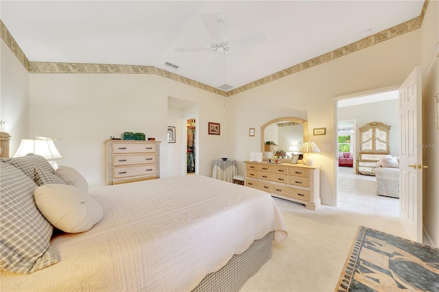 6330 SW 117th Loop, Ocala, FL 34476 - bedroom featuring light carpet, lofted ceiling, ceiling fan, and a walk in closet