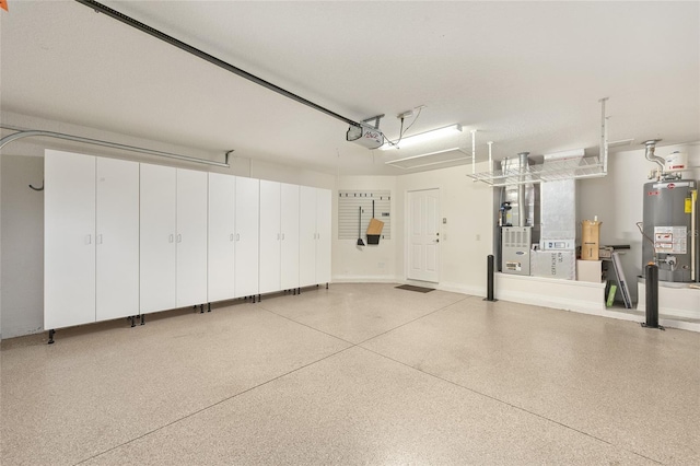 7243 SE 172nd Legacy Ln, The Villages, FL 32162 - garage featuring water heater and a garage door opener