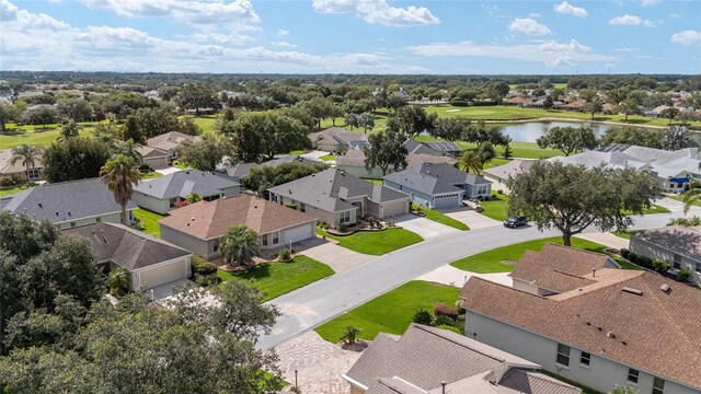 7243 SE 172nd Legacy Ln, The Villages, FL 32162 - aerial perspective of suburban area with a nearby body of water