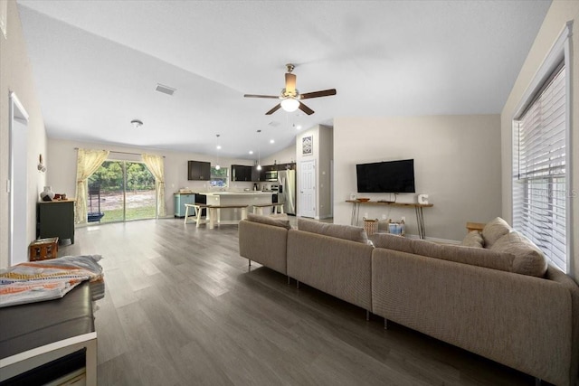 13479 SW 100th Ln, Dunnellon, FL 34432 - living room featuring vaulted ceiling, dark wood-style flooring, and a ceiling fan