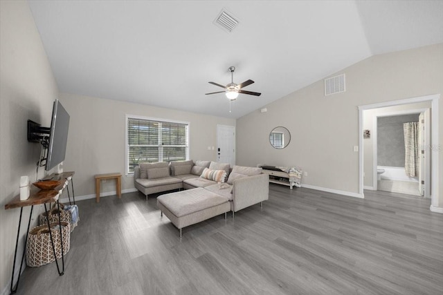 13479 SW 100th Ln, Dunnellon, FL 34432 - living area with lofted ceiling, a ceiling fan, and wood finished floors