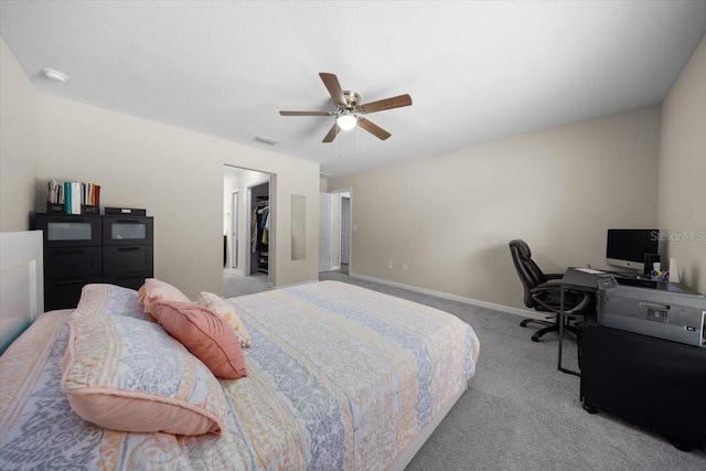 13479 SW 100th Ln, Dunnellon, FL 34432 - carpeted bedroom featuring a walk in closet, a ceiling fan, a desk, and a closet