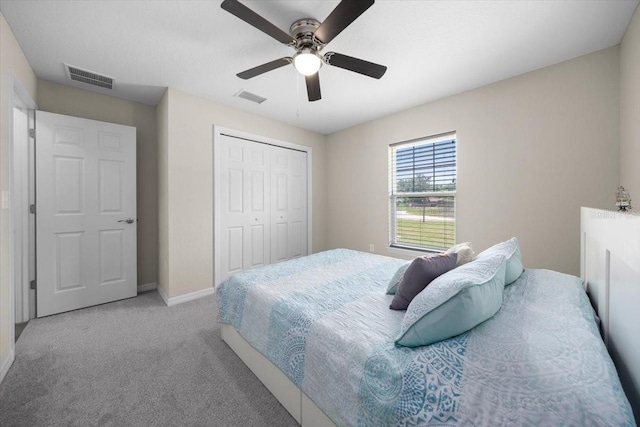 13479 SW 100th Ln, Dunnellon, FL 34432 - bedroom featuring carpet, a closet, and a ceiling fan