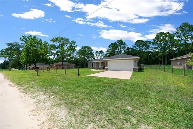 13479 SW 100th Ln, Dunnellon, FL 34432 - view of yard featuring a garage and driveway