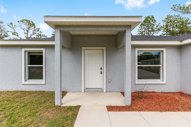 5 Water Pass, Ocala, FL 34472 - doorway to property with stucco siding