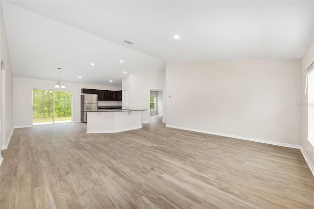 5 Water Pass, Ocala, FL 34472 - unfurnished living room with lofted ceiling, light wood-type flooring, and recessed lighting