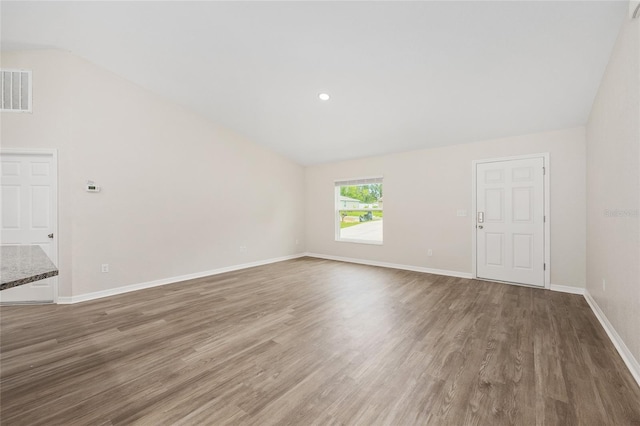 5 Water Pass, Ocala, FL 34472 - unfurnished living room featuring vaulted ceiling and wood finished floors