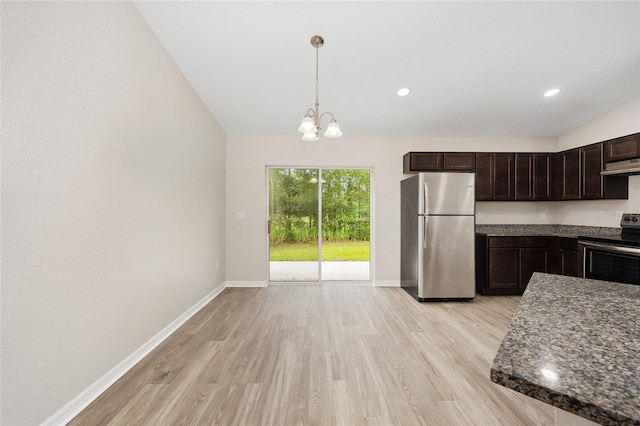 5 Water Pass, Ocala, FL 34472 - kitchen featuring appliances with stainless steel finishes, under cabinet range hood, light wood finished floors, dark brown cabinetry, and a chandelier