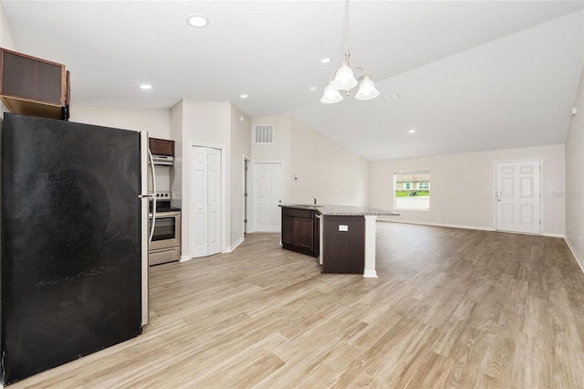 5 Water Pass, Ocala, FL 34472 - kitchen with appliances with stainless steel finishes, dark brown cabinetry, a chandelier, vaulted ceiling, and light wood-type flooring