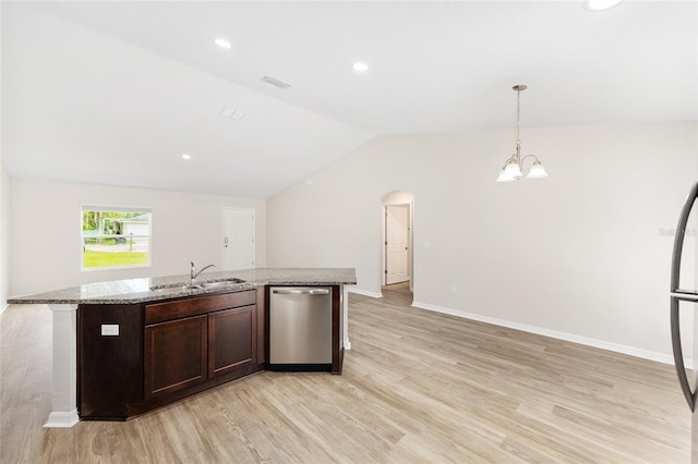 5 Water Pass, Ocala, FL 34472 - kitchen featuring stainless steel dishwasher, light wood-style floors, vaulted ceiling, a chandelier, and an island with sink