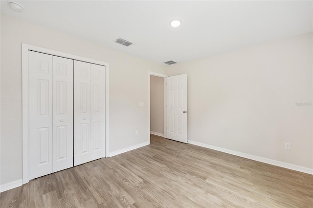 5 Water Pass, Ocala, FL 34472 - unfurnished bedroom featuring light wood-style floors and a closet