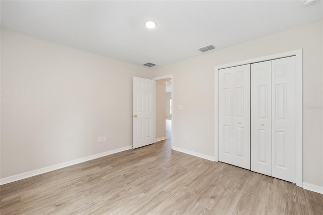 5 Water Pass, Ocala, FL 34472 - unfurnished bedroom featuring light wood-type flooring and a closet