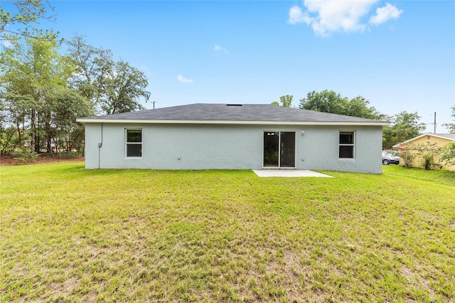 5 Water Pass, Ocala, FL 34472 - back of property with a patio, a lawn, and stucco siding