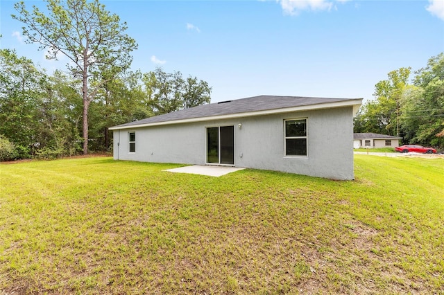 5 Water Pass, Ocala, FL 34472 - back of house featuring a patio, a yard, and stucco siding