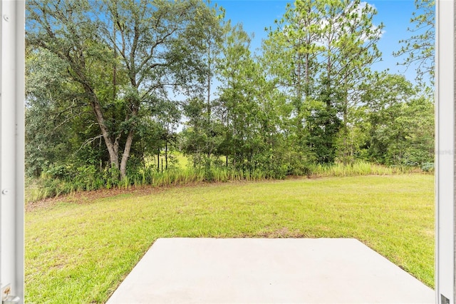 5 Water Pass, Ocala, FL 34472 - view of green lawn with a patio area