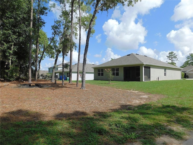 80 Hickory Course Loop, Ocala, FL 34472 - rear view of house featuring a yard and stucco siding