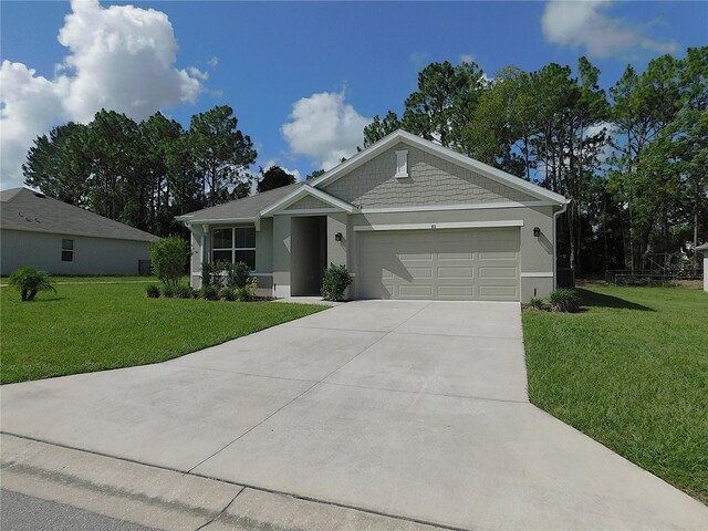 80 Hickory Course Loop, Ocala, FL 34472 - view of front of property with a front yard, driveway, an attached garage, and stucco siding