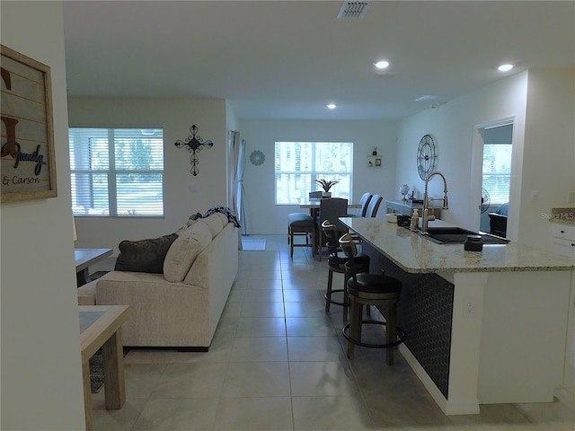 80 Hickory Course Loop, Ocala, FL 34472 - living area with plenty of natural light, light tile patterned floors, and recessed lighting