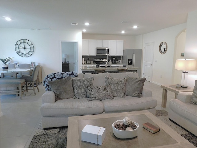 80 Hickory Course Loop, Ocala, FL 34472 - living room featuring arched walkways, recessed lighting, and light tile patterned floors