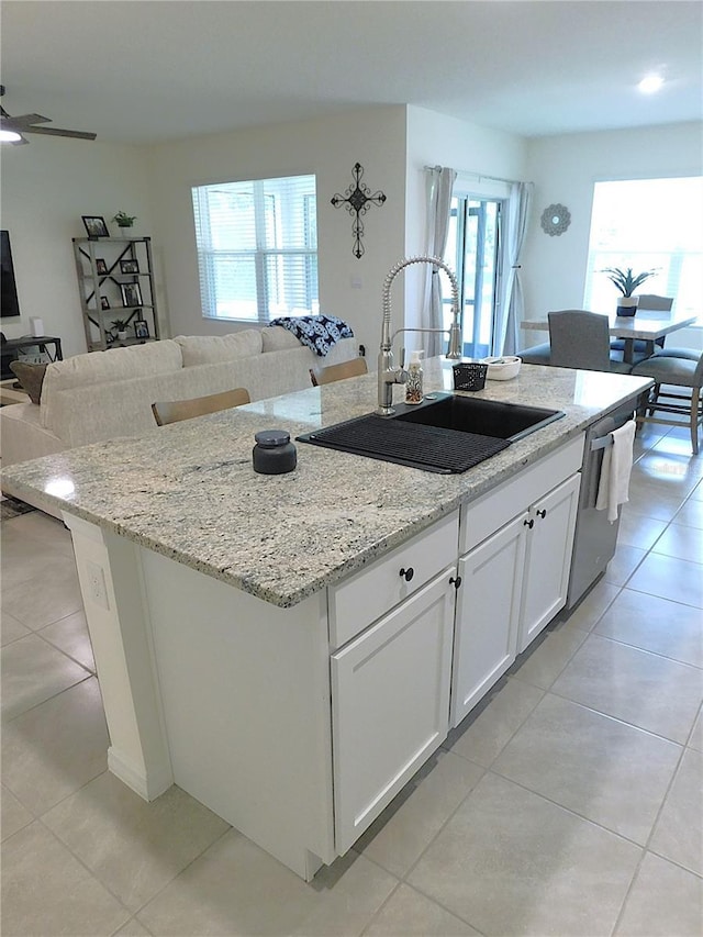 80 Hickory Course Loop, Ocala, FL 34472 - kitchen featuring open floor plan, a kitchen island with sink, light tile patterned floors, and stainless steel dishwasher