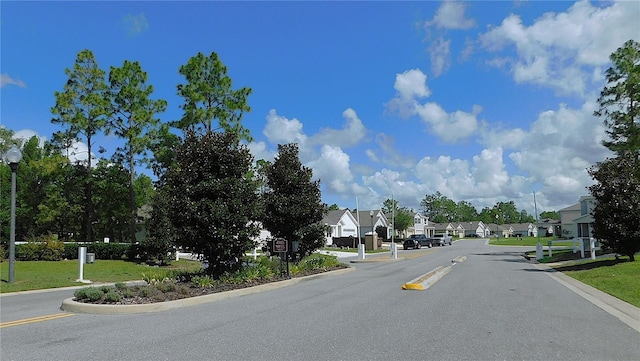 80 Hickory Course Loop, Ocala, FL 34472 - view of asphalt street with a residential view, street lighting, curbs, and traffic signs