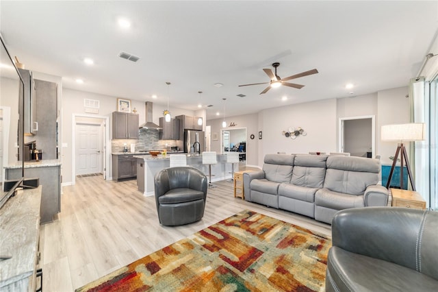 8913 SW 76th Ln, Ocala, FL 34481 - living room featuring a ceiling fan, light wood-style floors, and recessed lighting