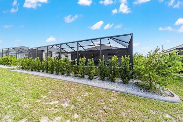 8913 SW 76th Ln, Ocala, FL 34481 - back of property featuring a yard and a lanai