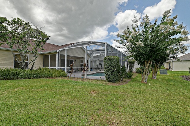 3146 Williams Rd, The Villages, FL 32162 - rear view of house with a yard, a lanai, an outdoor pool, and a patio