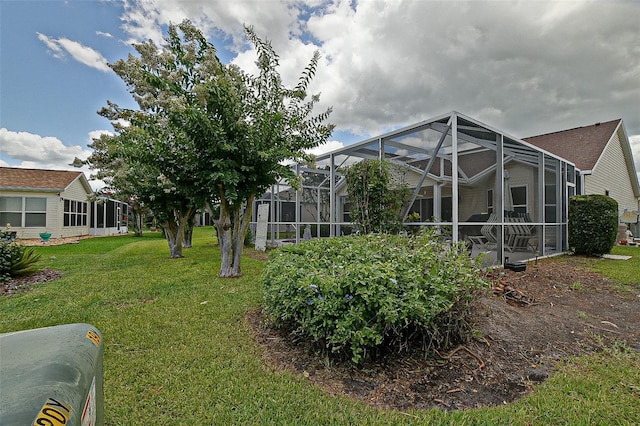 3146 Williams Rd, The Villages, FL 32162 - rear view of house featuring a lawn and a lanai