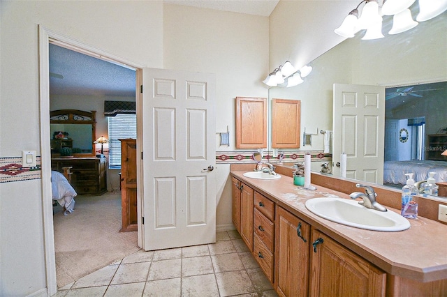 3146 Williams Rd, The Villages, FL 32162 - bathroom with connected bathroom, double vanity, and a chandelier