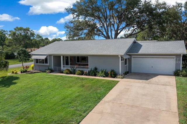 8461 SW 109th St, Ocala, FL 34481 - ranch-style home featuring covered porch, driveway, a front yard, a garage, and roof with shingles